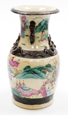 A Chinese porcelain crackle glazed vase, decorated with warriors in coloured enamels, within brown bands, relief chilin to the shoulders and dog of fo handles, 35cm high (AF). - 2