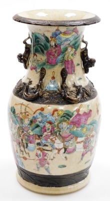 A Chinese porcelain crackle glazed vase, decorated with warriors in coloured enamels, within brown bands, relief chilin to the shoulders and dog of fo handles, 35cm high (AF). - 3