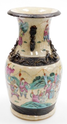 A Chinese porcelain crackle glazed vase, decorated with warriors in coloured enamels, within brown bands, relief chilin to the shoulders and dog of fo handles, 35cm high (AF). - 4