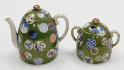 A Japanese Meiji period porcelain part tea set, decorated with multicolour roundels on a green ground with gilt karakusa scrolls, Fukugawa mark beneath Mount Fuji to underside, the teapot 15cm high. - 2