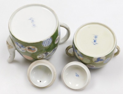 A Japanese Meiji period porcelain part tea set, decorated with multicolour roundels on a green ground with gilt karakusa scrolls, Fukugawa mark beneath Mount Fuji to underside, the teapot 15cm high. - 4