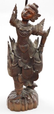 A Thai carved wooden figure of a dancer, on a domed foot, converted to a table lamp (AF), 94cm high overall. - 2