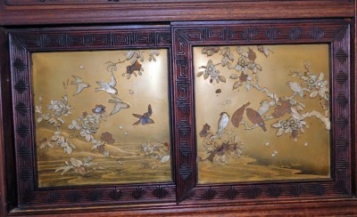 A Japanese Meiji period carved wood cabinet, elaborately decorated with birds, scrolls, flowers, etc., the sliding and hinged doors inset with Shibayama panels on gold lacquer ground with birds and flowers in mother of pearl and ivory on a bulbous base wi - 3