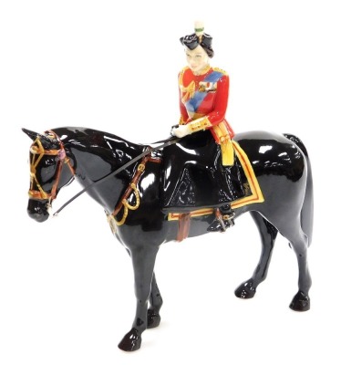 A Beswick 'Trooping The Colour' porcelain figure group, of Her Majesty The Queen on a Burmese horse, modelled by Amanda Hughes Lubeck, limited edition number 263/500, produced exclusively for Sinclairs, 25cm high, boxed with certificate.