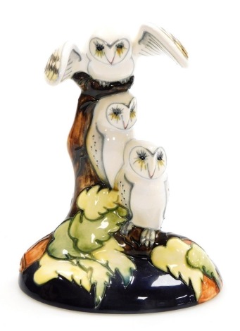 A Moorcroft pottery 'Moonlight Flight' figure group, designed by Emma Bossons, limited edition number 124/150, signed and dated 2010, impressed marks, 18cm high, boxed.