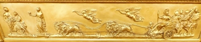 A 19thC gilt over mantel mirror, the inverted break front cornice mounted with spheres, above a Neoclassical frieze of cherubs, a lion drawn chariot, warriors, etc., above three rectangular bevel plates flanked by Corinthian pilasters, 89cm high x 132cm w - 2