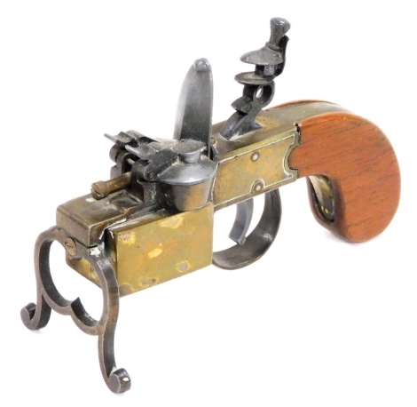 A Dunhill tinder pistol lighter, in brass with hardwood handle, provisional patent number 19273, registered number 7940, 14.5cm long.