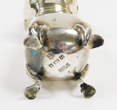 An Elizabeth II silver cruet set, comprising pepper pot, open salt blue glass liner, and mustard pot with blue glass liner, each piece decorated with a scroll and shell cast border, with three associated spoons, Birmingham 1957, weighable silver 4½oz, in - 2