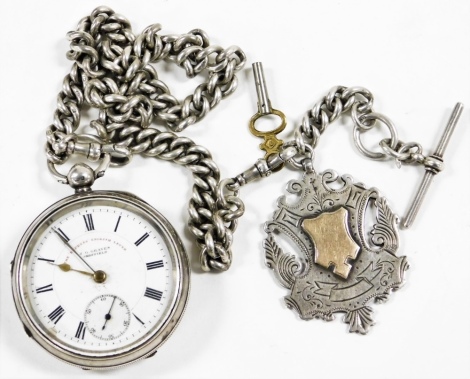 A J.G. Graves Sheffield The Express English Lever silver cased pocket watch, open faced, keywind, with a circular enamel dial bearing Roman numerals and gold coloured hands, subsidiary seconds dial, the case of plain form with shield and garter, Chester 1