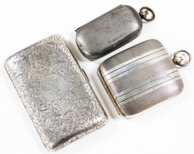 An Edward VII silver cigarette case, decorated profusely with scrolls, the central cartouche bearing monogram and date 1907, Birmingham 1902, 8cm wide, 2oz, a pewter sovereign and half sovereign case, with ring handle, 7cm wide overall, and a silver plate