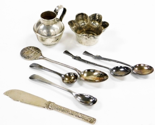 A group of small silver, to include miniature jug, Birmingham 1953, 4cm high, a butter knife, the handle with bright cut decoration of flowers and scrolls, Birmingham 1890, etc., 3oz overall.