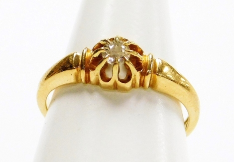 An 18ct gold diamond dress ring, the tiny diamond in cluster claw setting with etched design shoulders, ring size L, 3g all in.