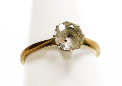 A 9ct gold and silver dress ring, set with white paste stone in floral setting, ring size R½, 1.8g all in.