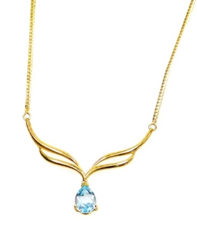 A 9ct gold pendant and chain, the teardrop shaped pendant a blue zircon, with two fan design pendant mount, 4cm wide, on a curb link chain, 44cm long overall.