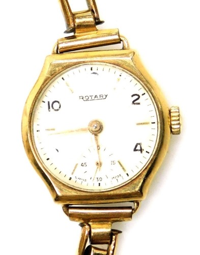 A Rotary 9ct gold lady's wristwatch, the watch head in a 9ct gold case with cream coloured dial and seconds dial, on a rolled gold expanding bracelet, 16.7g all in.