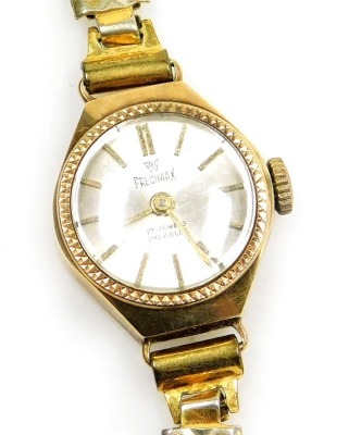 A Precimax lady's wristwatch, with small silver coloured dial, in a yellow metal case unmarked, 1.5cm wide, on a plated strap, 12,6g all in.