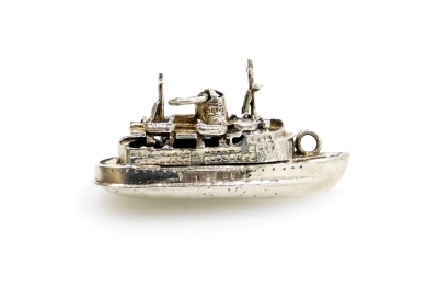 A Queen Elizabeth II white metal pendant/charm, formed as the boat The Queen Elizabeth II, white metal stamped silver, 3cm wide, 8.7g all in.