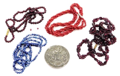 A group of costume jewellery necklaces, comprising three agate two strand necklaces and a hammered pewter Celtic knot brooch.