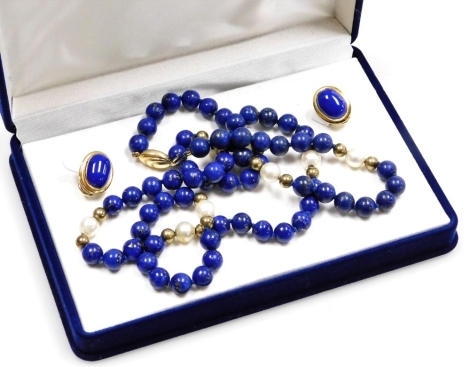 A lapis lazuli necklace and earring set, the necklace with lapis and pearl brakes, with a 9ct gold woven design clasp, and a pair of matching clip on earrings, in presentation box, necklace 71cm long.