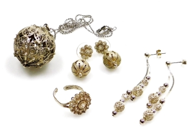 A group of silver filigree jewellery, comprising a pair of silver drop ball earrings, 6cm high, a filigree ball pendant on plated chain, the pendant 3cm high, filigree dress ring unmarked, and a pair of orb filigree drop earrings, each marked 925, 27.2g a