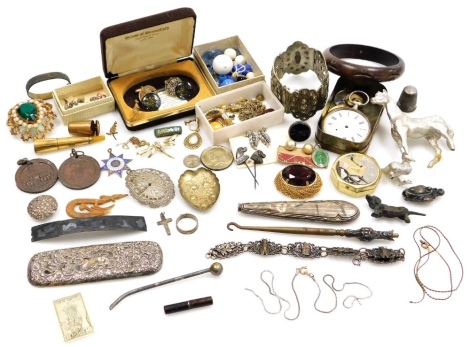 A group of costume jewellery, comprising an Eastern inspired plated bangle, various drop earrings, pearl hoop earrings, cuff links, silver plated pocket watch, filigree type bracelets, part button hooks, etc. (a quantity)