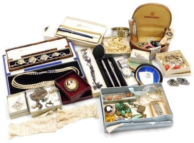 A group of costume jewellery, comprising cultured pearl necklace, paste stone set buckles and brooches, coral and filigree bracelet, watch chains, earrings, evening purses, compacts, etc. (a quantity)