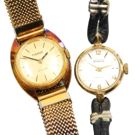 An Ernest Borel lady's 9ct gold cased wristwatch, circular champagne dial bearing Arabic numerals at evens, on a leather strap, together with a Tissot Stylist gold plated lady's wristwatch, on an expanding bracelet. (2)