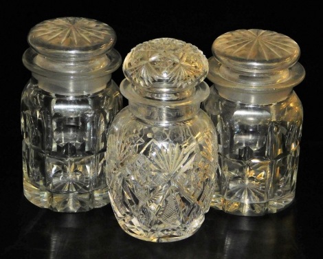 Three cut glass pickle jars and covers, comprising a pair, 12cm high, and a further example, 5cm high.