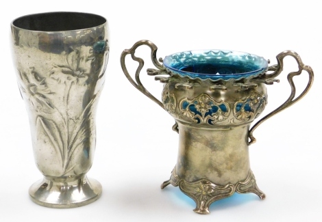 A German Kayserzinn Art Nouveau pewter vase, of tapering form, no 4089, 17cm high, and a WMF two handled vase with blue glass liner, possibly for caviar, and receptacles for spoons, 17cm wide. (2)