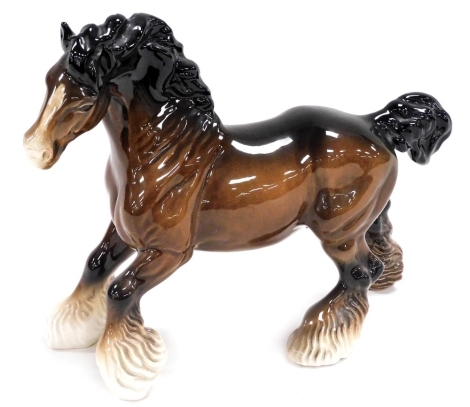 A Beswick pottery figure of a cantering shire horse, printed marks, 21cm high.