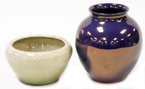 A Moorcroft pottery purple lustre vase, of globular form with a raised lip, impressed marks to underside and no. 189, 20cm high, and a Moorcroft pottery bowl, in a pale green glaze decorated with a raised band of vertical markings, impressed marks, 11cm h