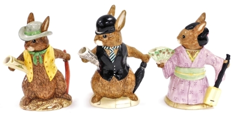 Three Royal Doulton Bunnykins teapots, comprising London City Gent D6966, Aussie Explorer D7027 and Geisha Girl D7126.