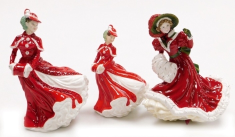 Three Royal Doulton porcelain Christmas figures, comprising Christmas Celebration HN4721, Christmas Day HN4552 and Christmas Day HN4723.