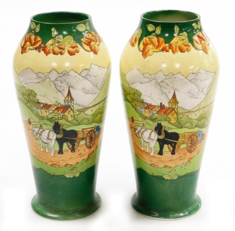 A pair of early 20thC Frank Beardmore pottery vases, Sutherland Art Ware, decorated in The Two Horses pattern, printed marks, 26cm high.