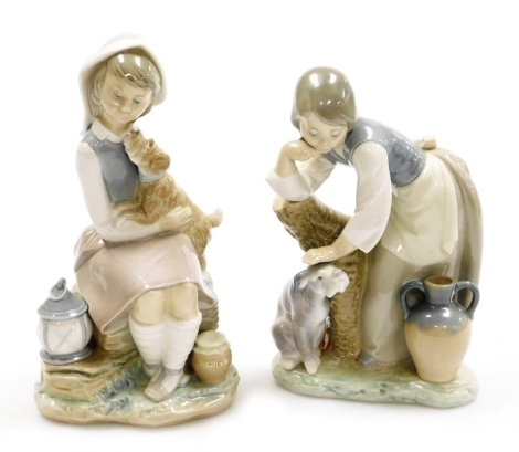 Two Lladro porcelain figures, comprising girl seated with dogs, 22cm high and girl leaning against tree stump patting a dog, 20cm high, one boxed.