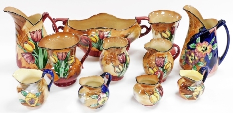 A group of H&K Tunstall Viola pattern pottery, to include jugs of varying sizes, and a two handled vase, 36cm wide.