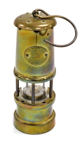 A Hockley Lamp and Limelight Company brass miner's lamp, 17cm high.