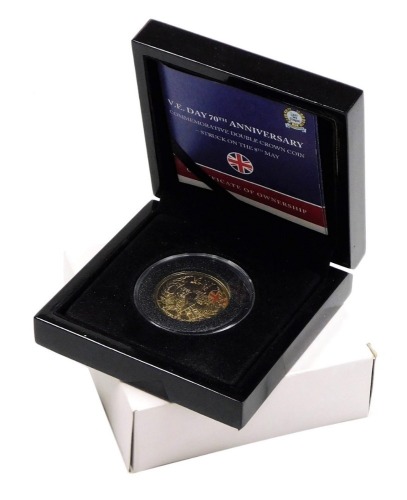 A VE Day 70th Anniversary commemorative double crown coin, issued in 2015, in 9ct white gold layered with 24ct yellow gold, 4g, with certificate, in fitted case.