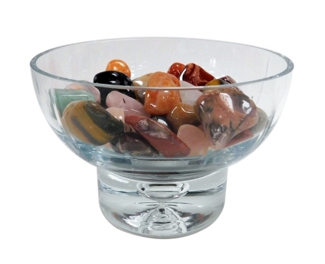 A cut glass bowl, containing polished hardstone pebbles, 17cm wide.