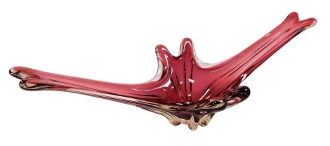 A late 20thC Murano cranberry glass bowl, of elongated star form, 68.5cm wide.