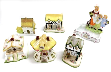 Five Coalport porcelain pastille burner cottages, comprising The Master's House, Swiss Cottage, Thatched Cottage, The Old Curiosity Shop, and The Coaching Inn, together with a Yardley English Lavender figural soap dish. (6)