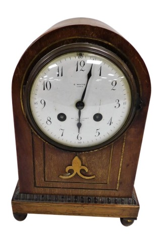 A late 19thC French mahogany cased mantel clock, with brass inlay, for E White, 32 Haymarket, London, circular enamel dial bearing Arabic numerals, eight day movement by AD Mougin with coil strike, number 53525, the case of domed form, raised on four bras