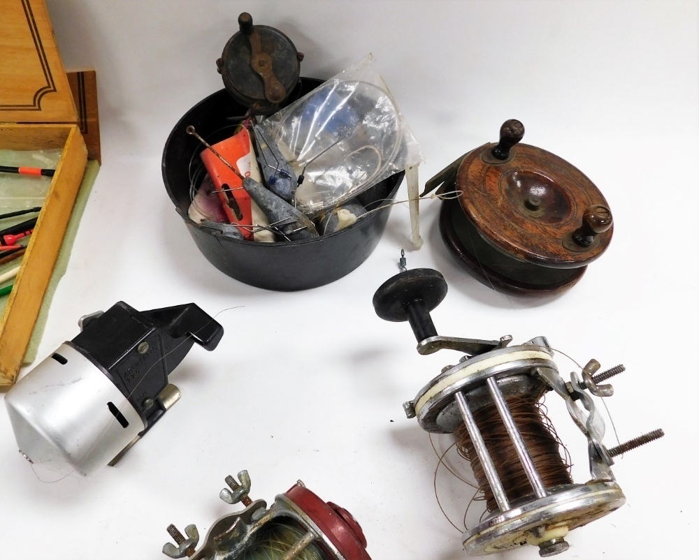 Assorted fishing reels, including an Intrepid rim fly reel, Garcia Mitchell  624 boat reel, and a