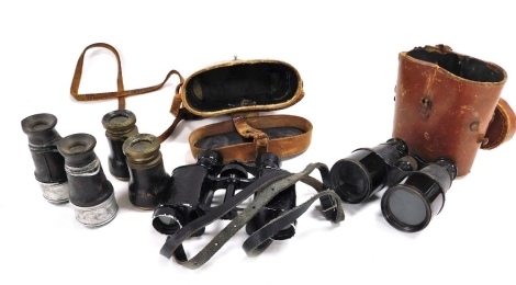 A pair of military binoculars, cased, named to AG Elliot, Royal Field Artillery, a pair of Lumiere of Paris War Office model binoculars, cased, and two pairs of field glasses. (4)