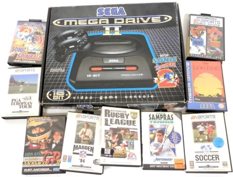 A Sega Megadrive II video game console, with Sonic the Hedgehog 2, boxed, and further video games.