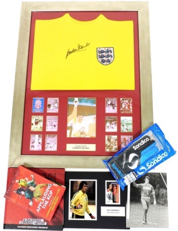 An English yellow football shirt, bearing autograph for Gordon Banks, with a certificate of authenticity verso, together with two books on Liverpool Football Club, signed autograph of Ray Clemence, from Grafferman Autographs, black and white photograph, a