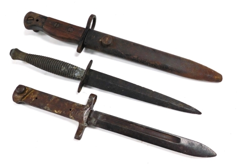 A Fairbairn-Sykes commando knife, a World War I bayonet, bearing number 90803, and a WSC bayonet and scabbard. (3)