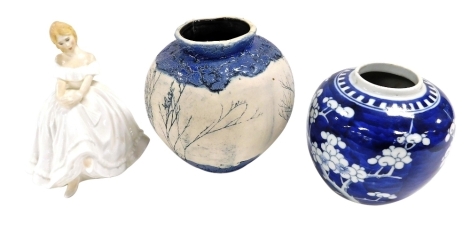 A Tenmoku pottery vase, sgrafito decorated with trees against a blue glazed ground, seal mark and label, 13cm high, together with a Chinese ginger jar, decorated with prunus blossom against a cracked ice ground, and a Royal Doulton figure modelled as Heat