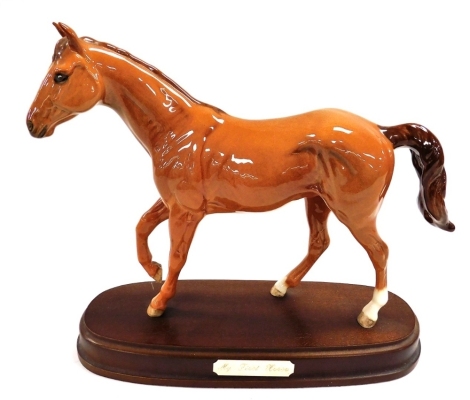 A Royal Doulton pottery figure modelled as My First Horse, raised on an oval base, printed mark.