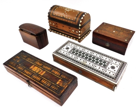 A Victorian rosewood drawing instrument box, inlaid cribbage box, containing two packs of playing cards, early 20thC walnut cigarette box, Damascus domed musical box, and an Indian hardwood and ivory inlaid two division cigarette box. (5)